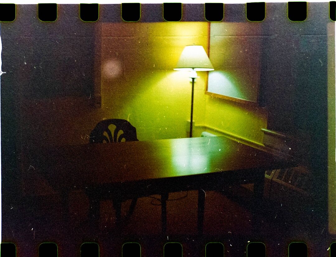 Old television set glowing in a dim room